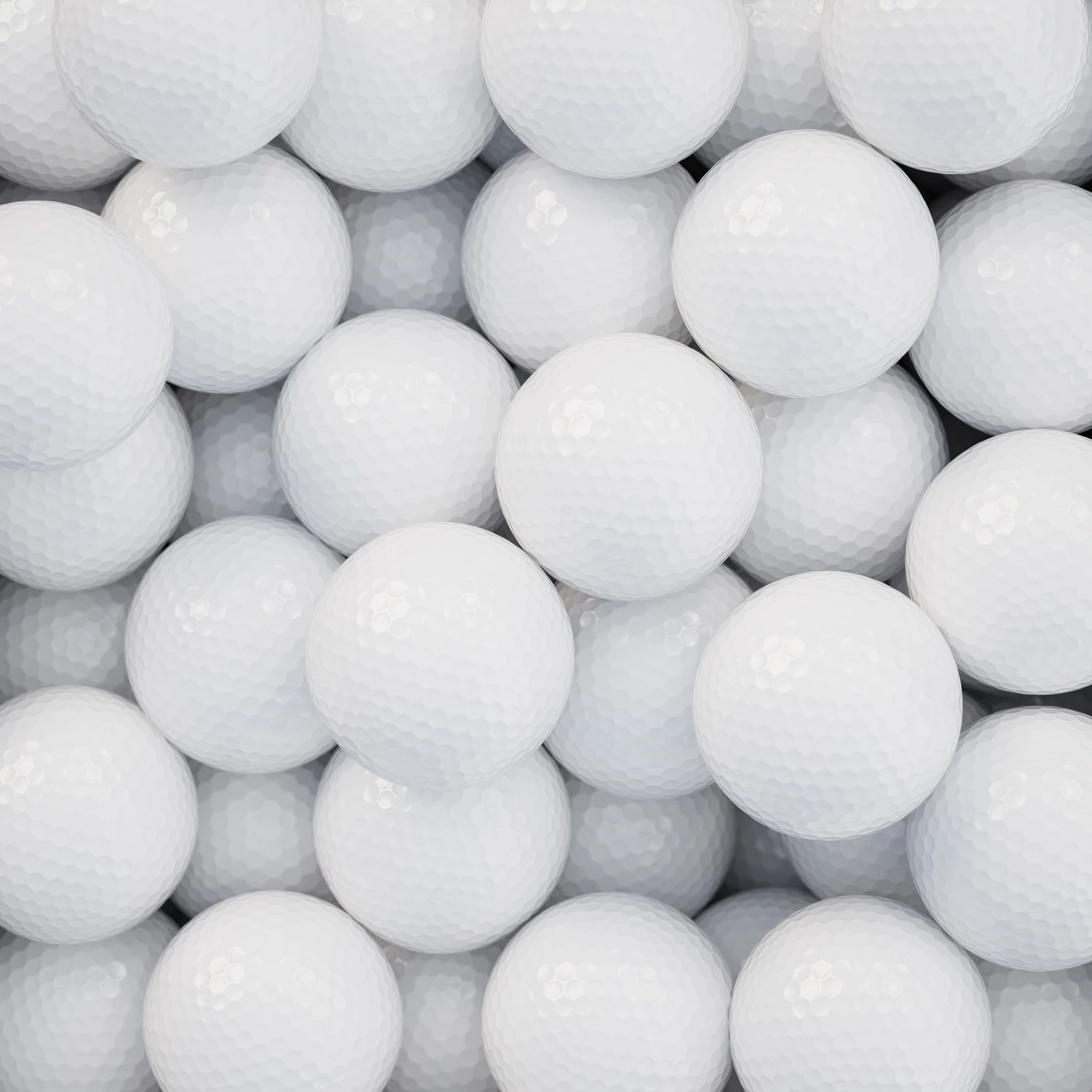 Golf balls in a container close-up